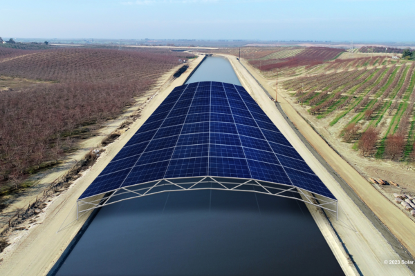 Rendering of solar panels over wide spanning irrigation canal.