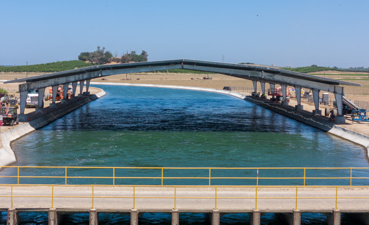 Solar panel structure over large irrigation canal.