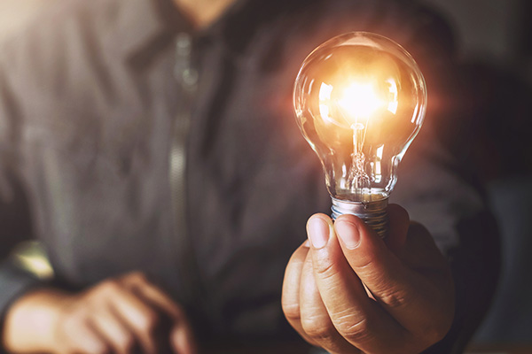 Man holding a light bulb