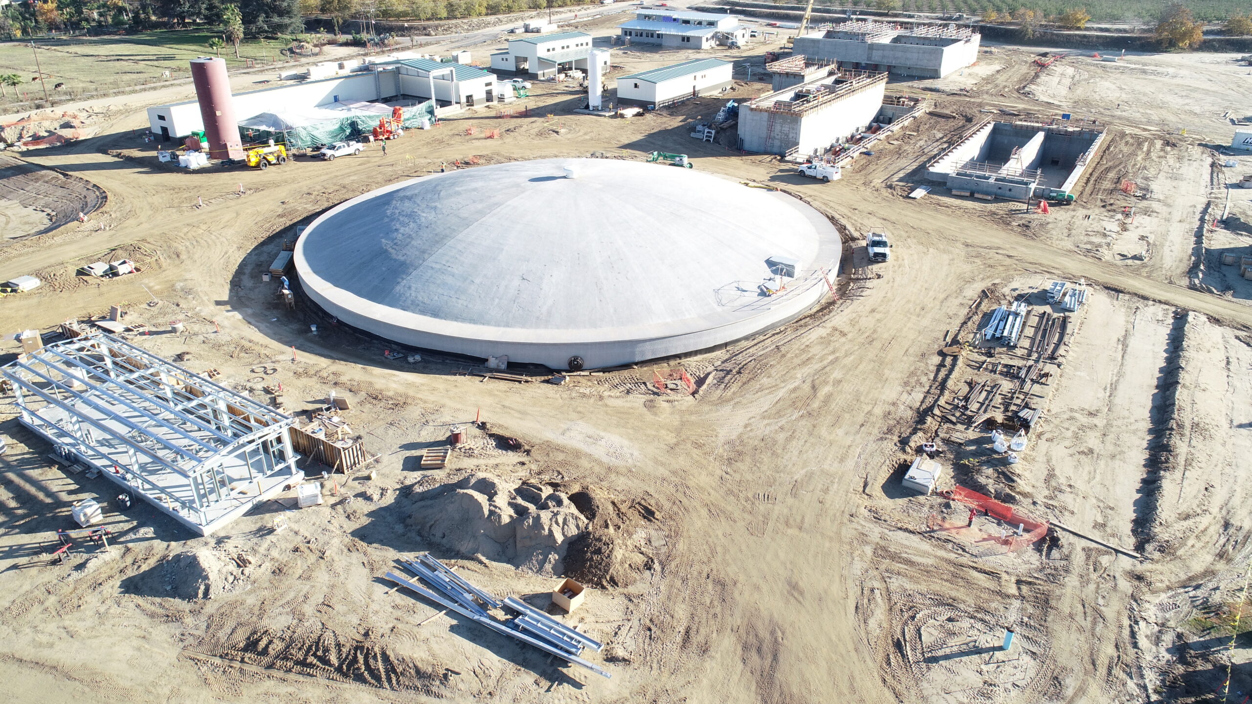 Aerial view of construction along a riverside