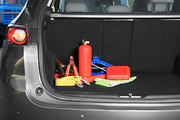 Set of car safety equipment in trunk such as a fire extenguiser